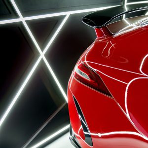 luxury-red-car-closeup-details-with-reflections-of-neon-lights-in-it.jpg